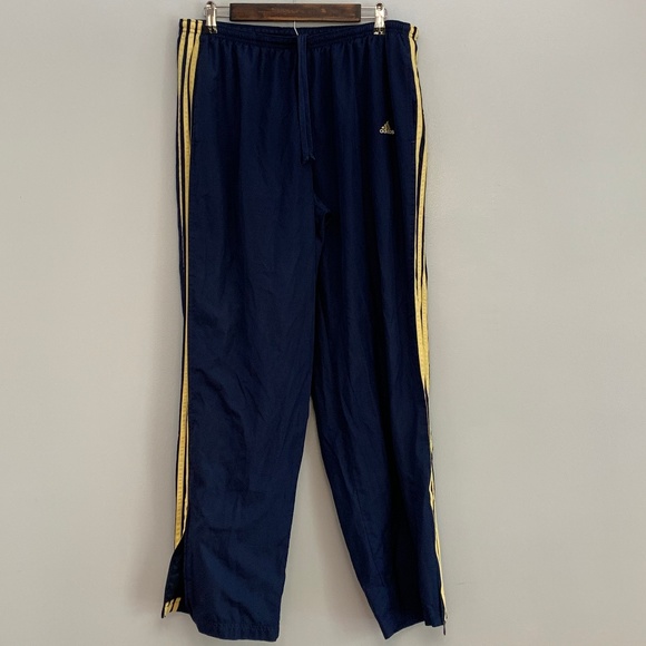 navy blue and yellow track pants
